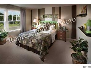 7008 Meyer Road Fort Mill, SC 29715 - Photo 6 of 6 a bed sitting in a bedroom next to a window