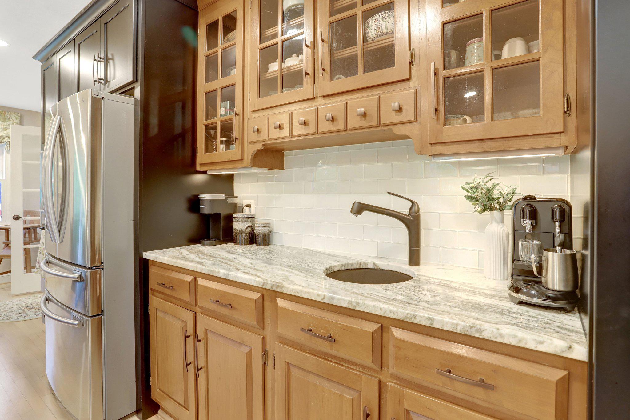 7506 Oriole Avenue Springfield, VA 22150 - Photo 13 of 67 a kitchen with stainless steel appliances granite countertop a sink and cabinets