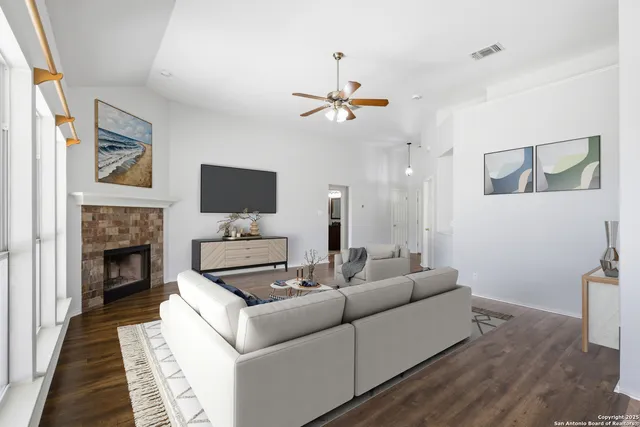 a living room with furniture and a fireplace