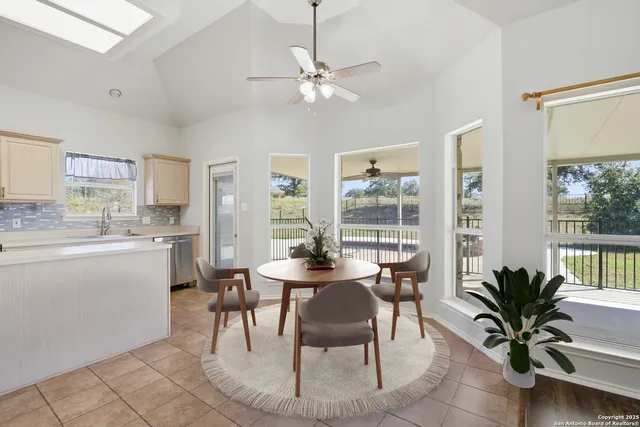 a dining room with furniture and window