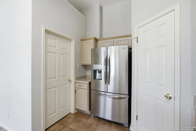 a white refrigerator freezer and a dishwasher in a kitchen
