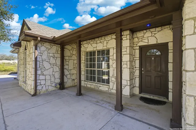 a view of a front door with outdoor space