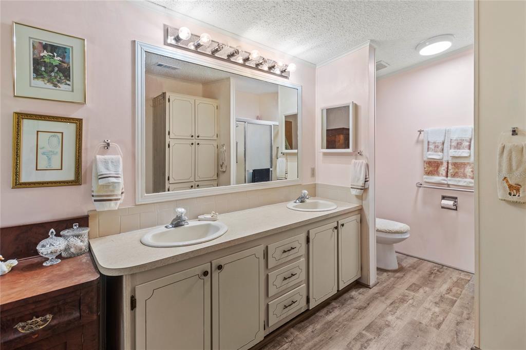 83 Eagle Circle Ellenton, FL 34222 - Photo 28 of 60 a spacious bathroom with a granite countertop sink a toilet and a mirror