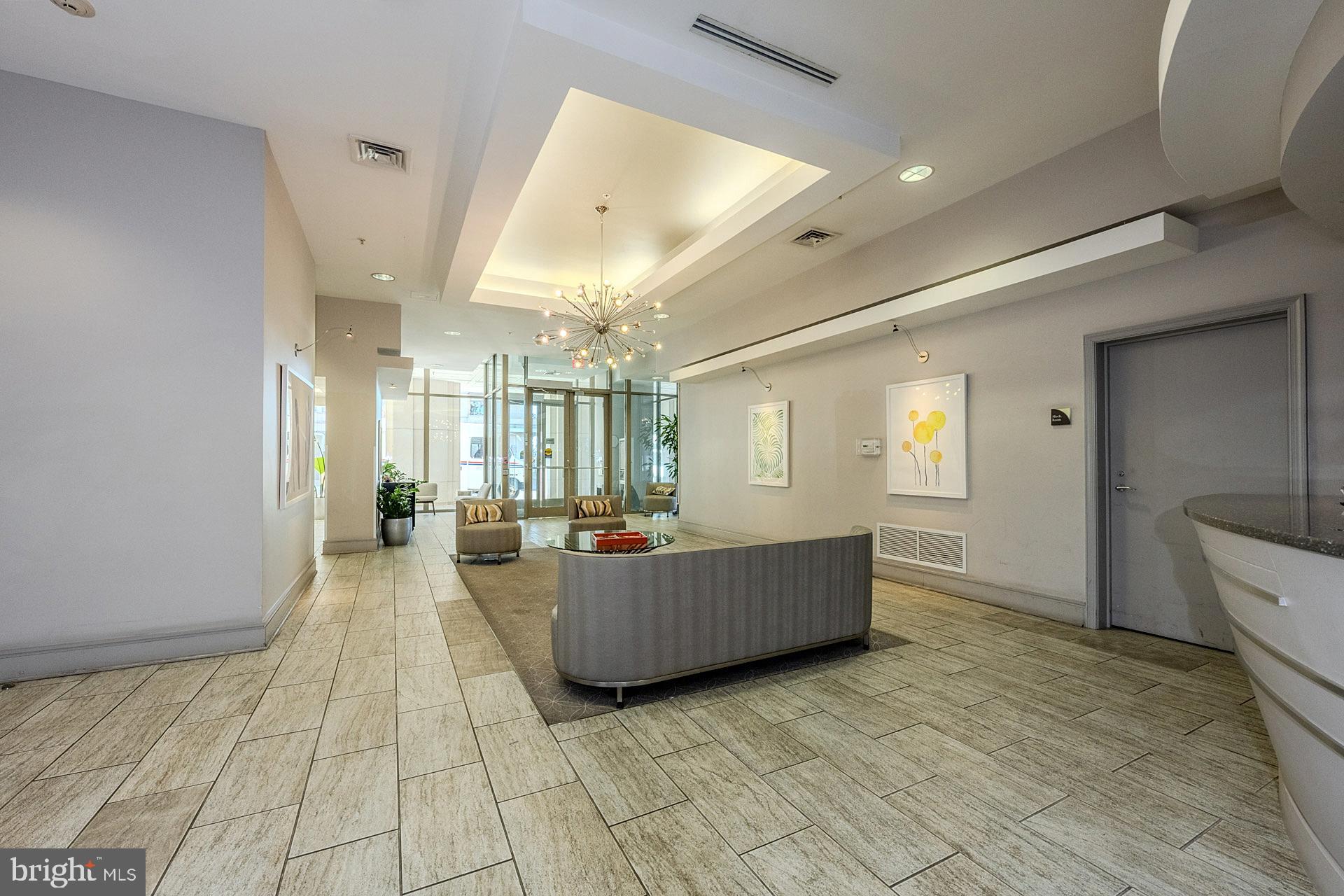 3650 South Glebe Road, Unit 460 Arlington, VA 22202 - Photo 23 of 38 a living room with furniture and a chandelier