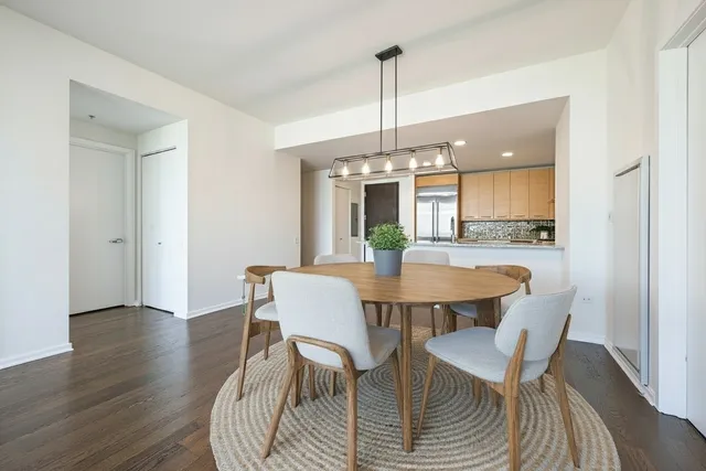 a view of a dining room with furniture window and wooden floor