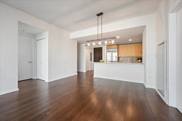 a view of a kitchen with a dishwasher cabinets and wooden floor