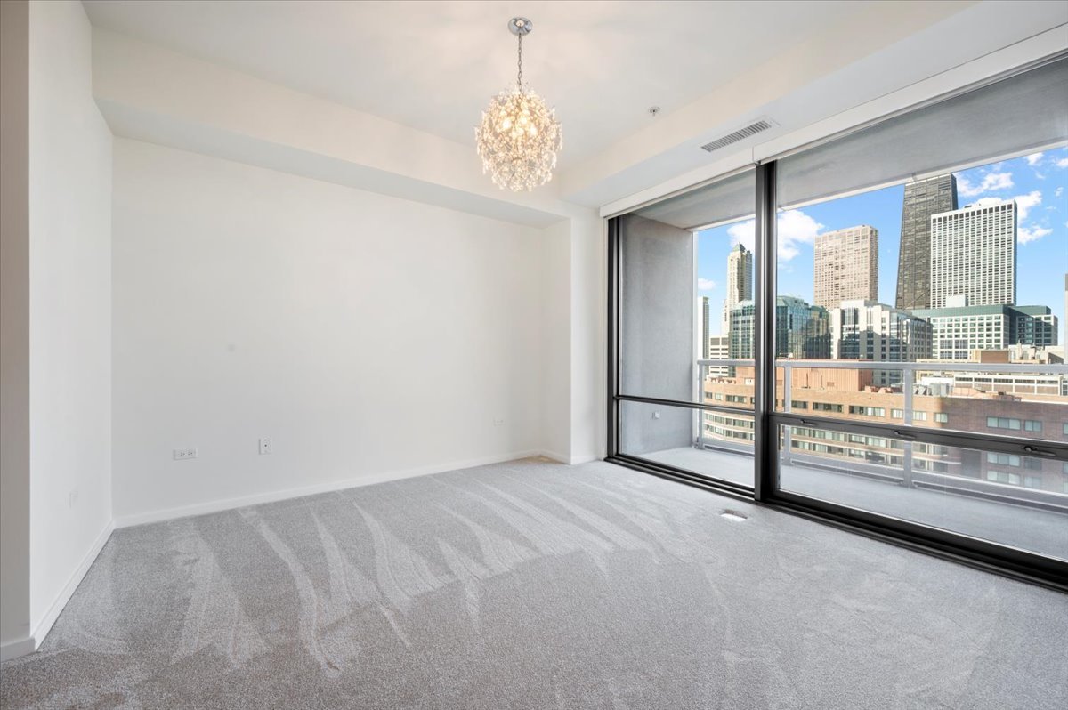 240 East Illinois Street, Unit 2204 Chicago, IL 60611 - Photo 26 of 50 a view of an empty room and window