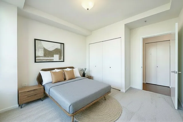 a bedroom with a bed and a couch