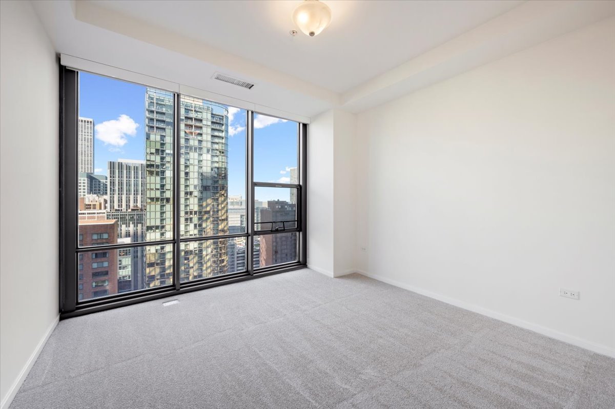 240 East Illinois Street, Unit 2204 Chicago, IL 60611 - Photo 33 of 50 a view of an empty room with glass door