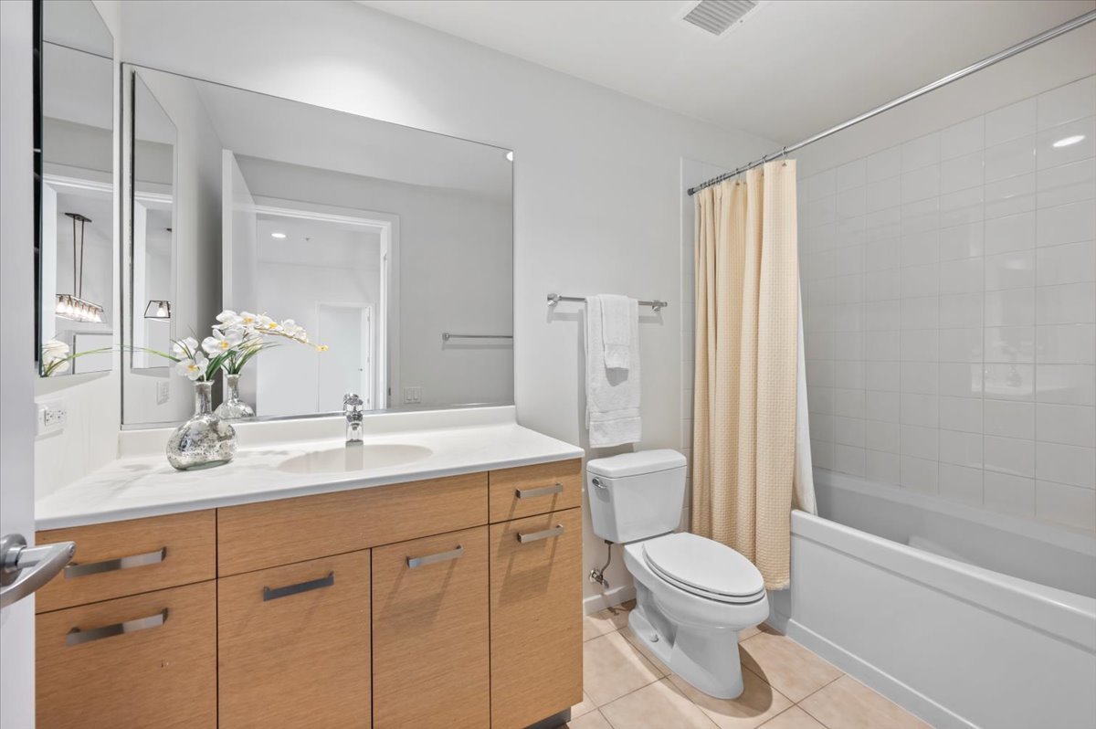 240 East Illinois Street, Unit 2204 Chicago, IL 60611 - Photo 35 of 50 a bathroom with a sink a toilet and shower