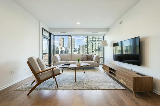 a living room with furniture and a flat screen tv