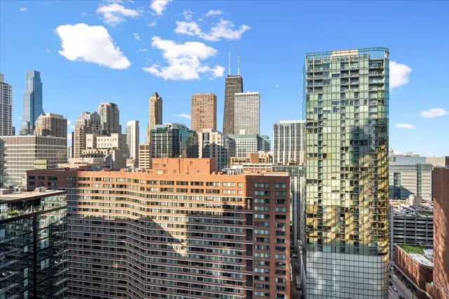 a view of city with tall buildings