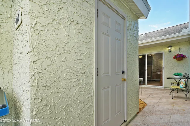 a front view of a house with outdoor seating