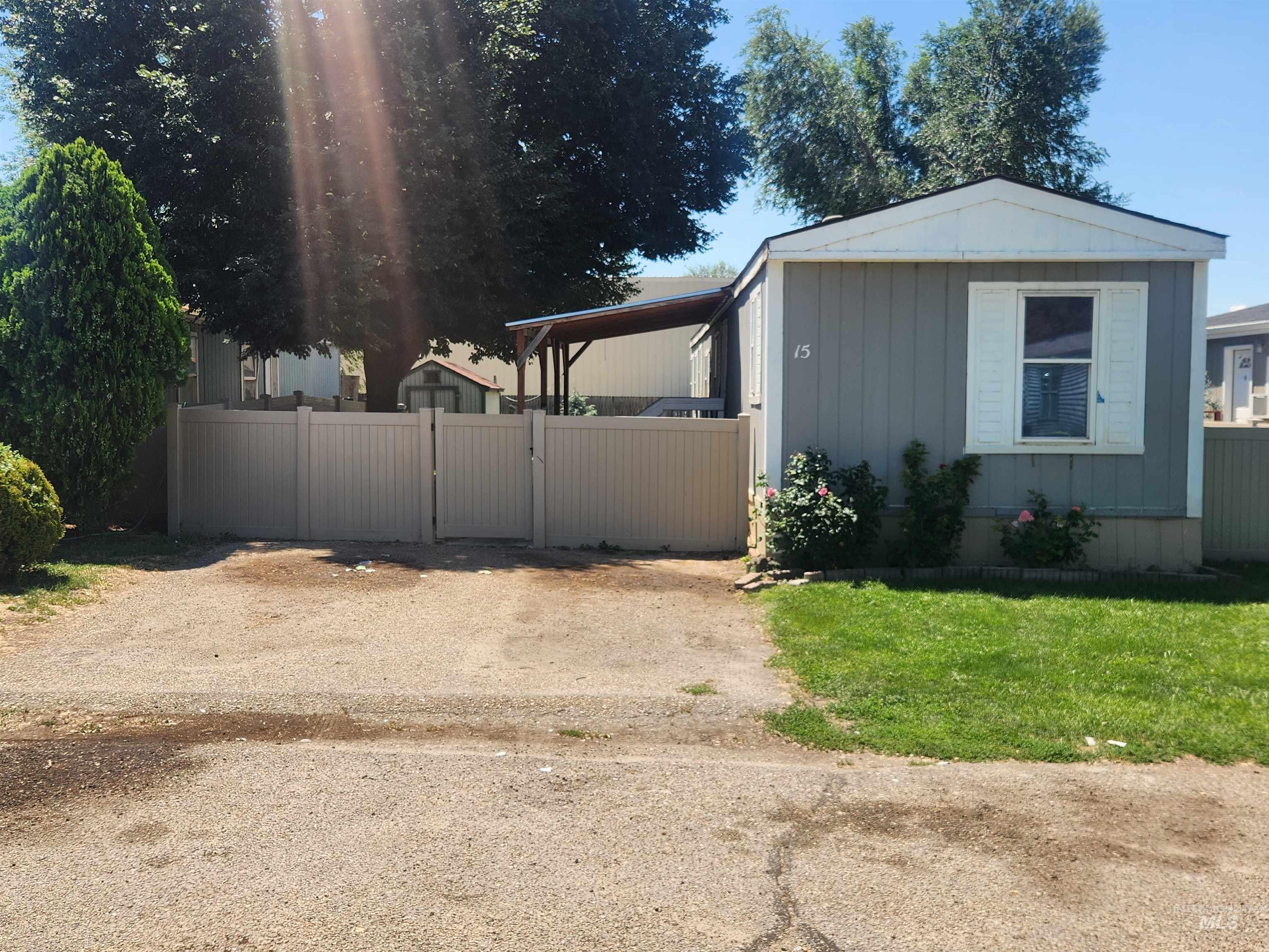 616 North Kings Road Nampa, ID 83687 - Photo 1 of 12 Single-story residence featuring gray siding and white window shutters