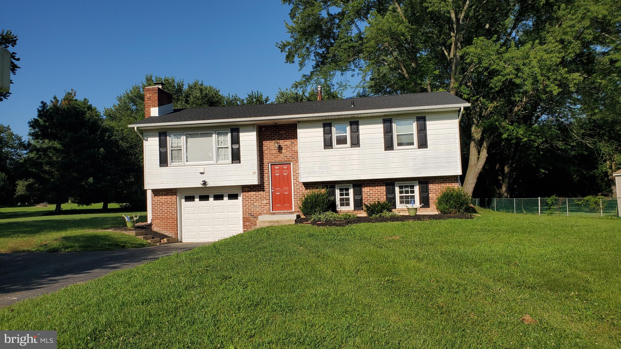 70 Zion Acres Road North East, MD 21901 - Photo 1 of 21 a front view of a house with a yard and trees