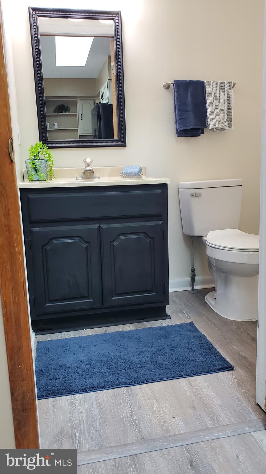 70 Zion Acres Road North East, MD 21901 - Photo 11 of 21 a bathroom with a sink a toilet and mirror