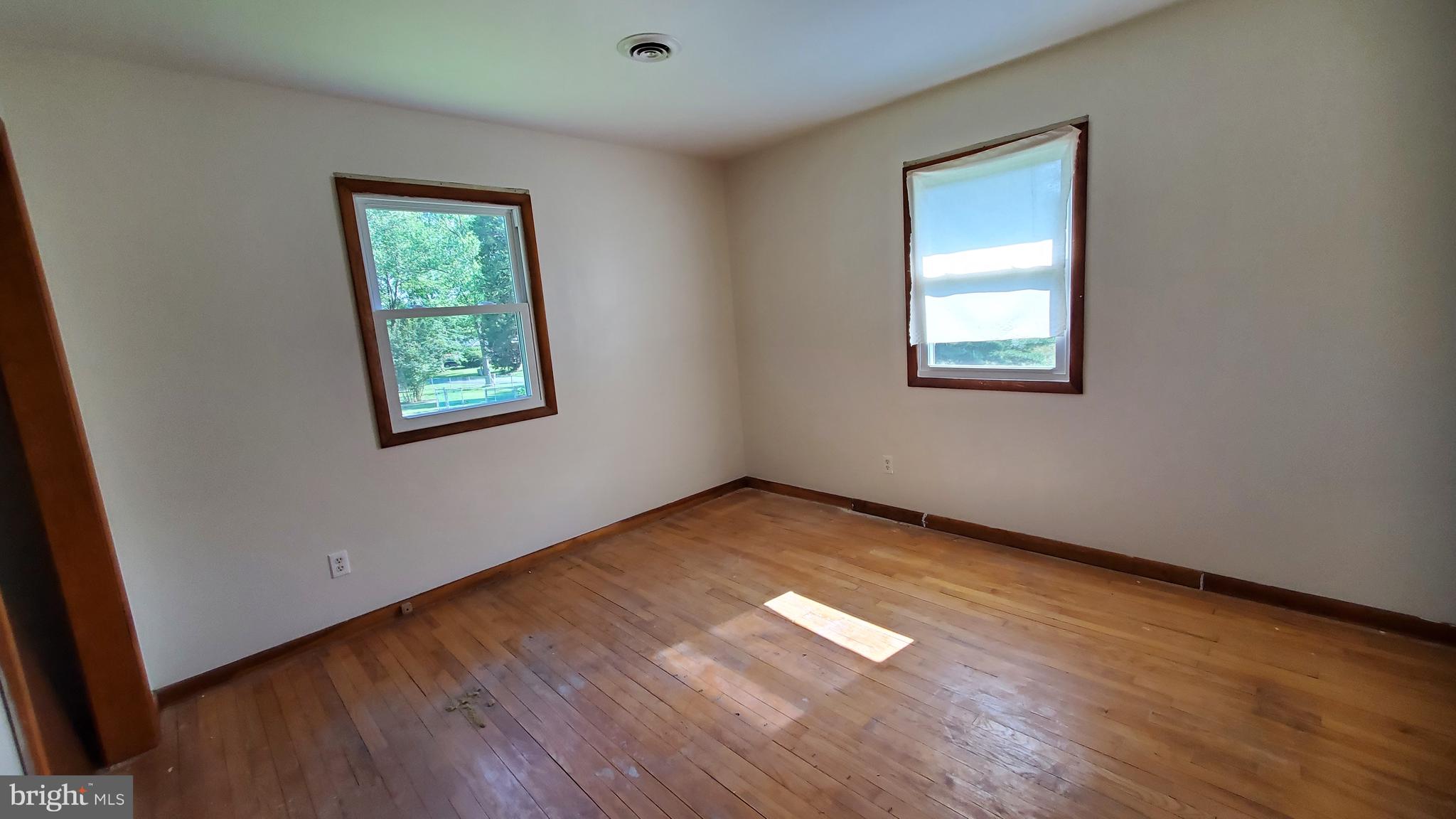 70 Zion Acres Road North East, MD 21901 - Photo 14 of 21 an empty room with wooden floor and windows