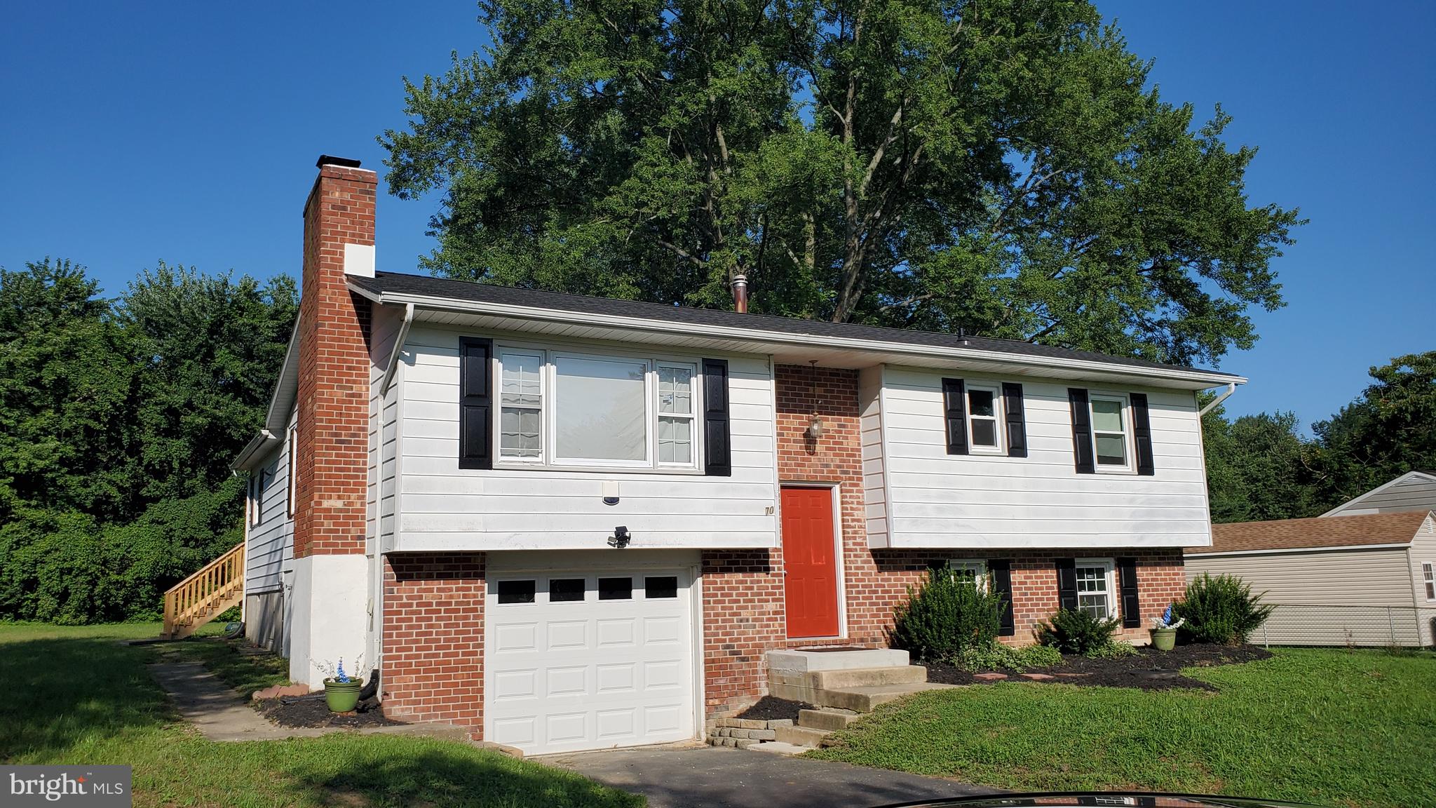 70 Zion Acres Road North East, MD 21901 - Photo 20 of 21 a front view of a house with a yard and garage