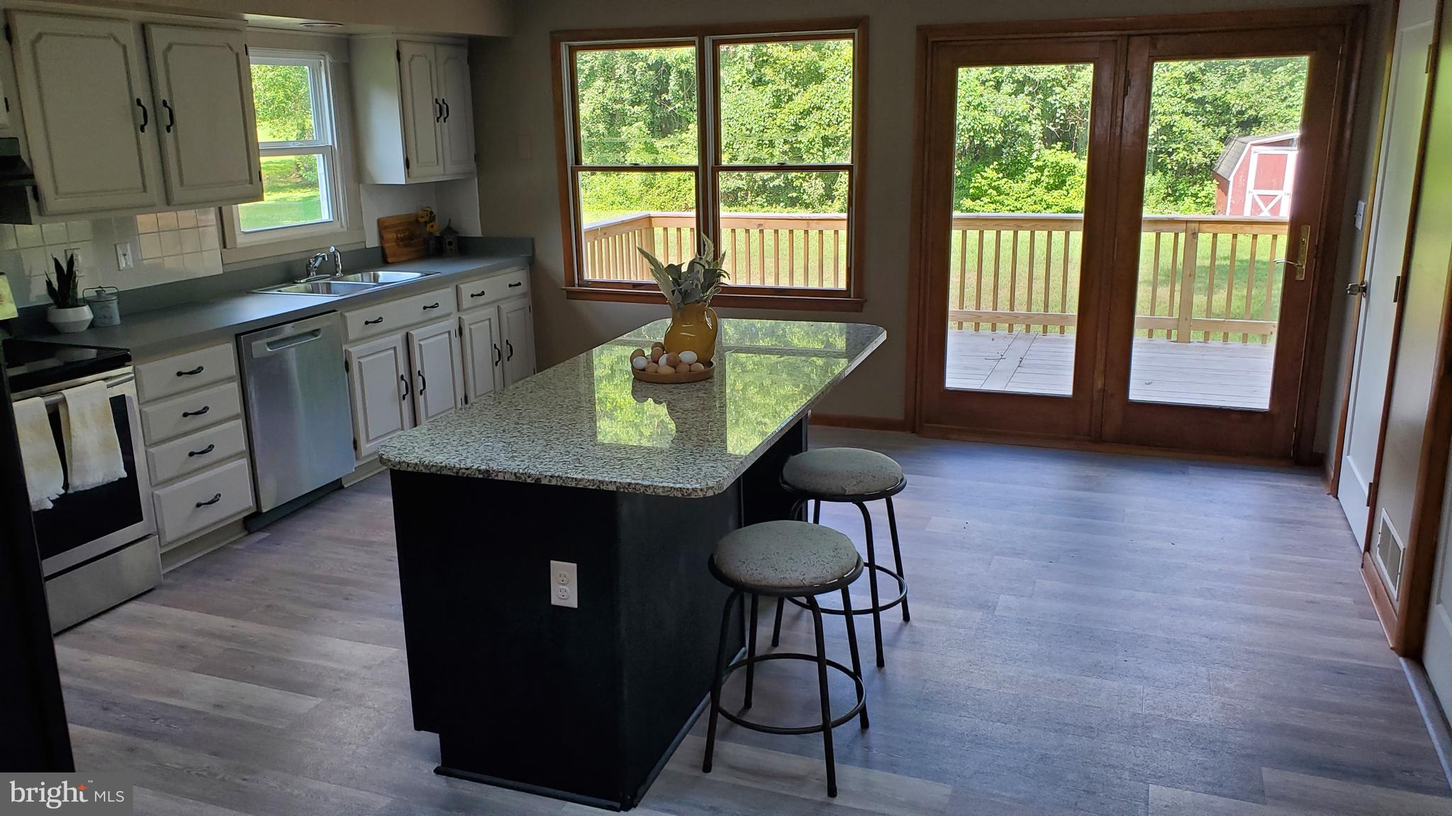 70 Zion Acres Road North East, MD 21901 - Photo 7 of 21 a kitchen with stainless steel appliances granite countertop a stove a sink and a microwave