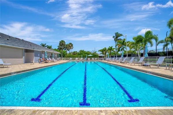 a view of swimming pool with outdoor seating