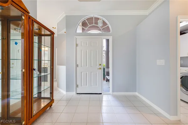a view of a entryway door with hallway