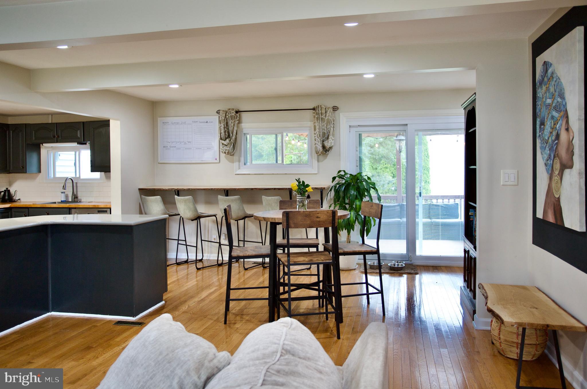 709 Manor Terrace Moorestown, NJ 08057 - Photo 15 of 37 a view of a dining room with furniture and wooden floor