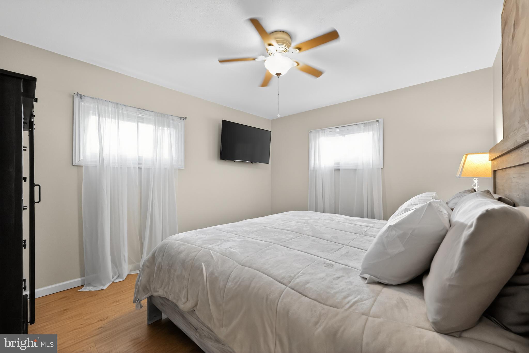 709 Manor Terrace Moorestown, NJ 08057 - Photo 23 of 37 a bedroom with a bed and a chandelier