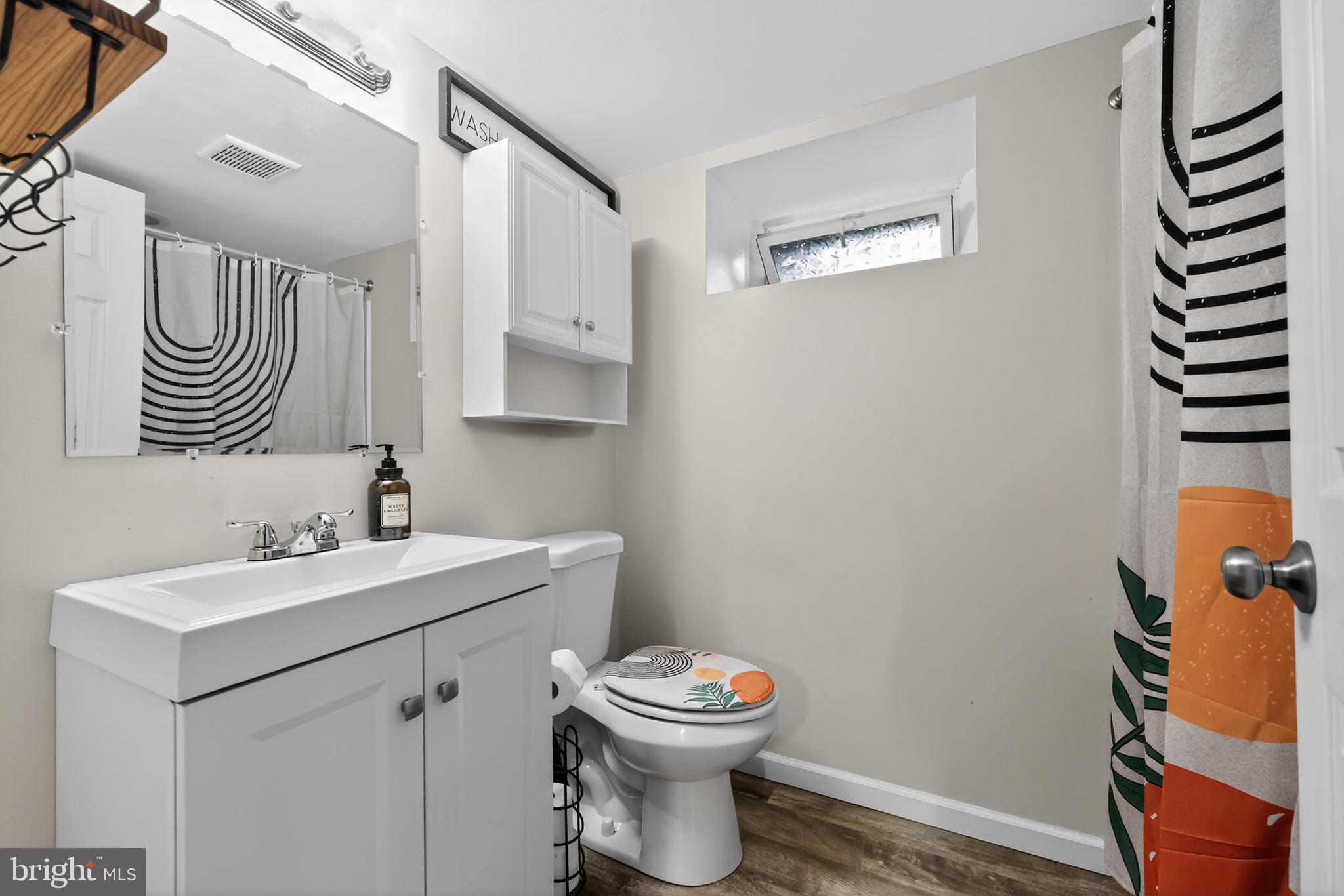 709 Manor Terrace Moorestown, NJ 08057 - Photo 24 of 37 a bathroom with a sink a toilet and a mirror