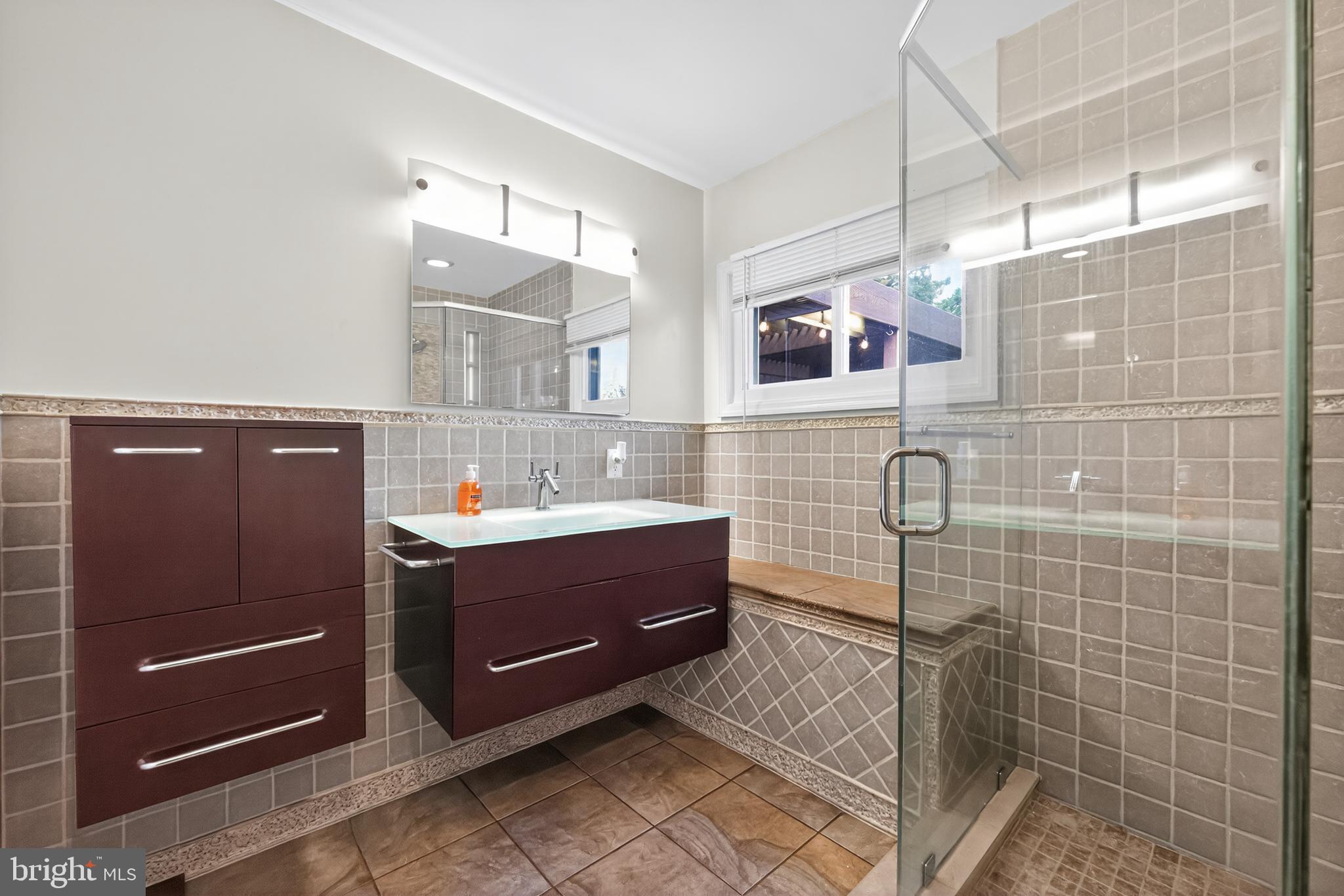 709 Manor Terrace Moorestown, NJ 08057 - Photo 25 of 37 a bathroom with a sink mirror and shower