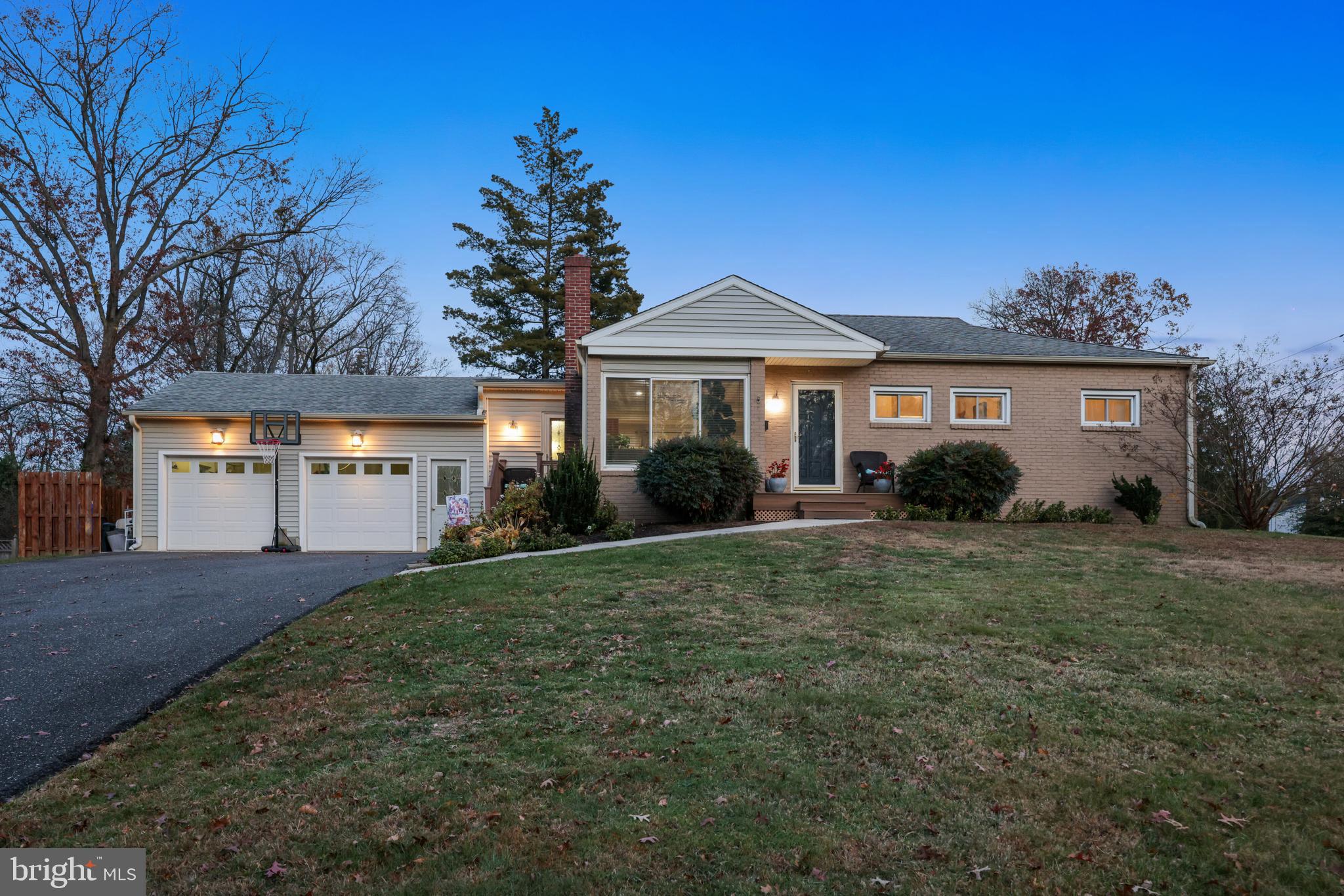 709 Manor Terrace Moorestown, NJ 08057 - Photo 30 of 37 a front view of a house with a yard and garage