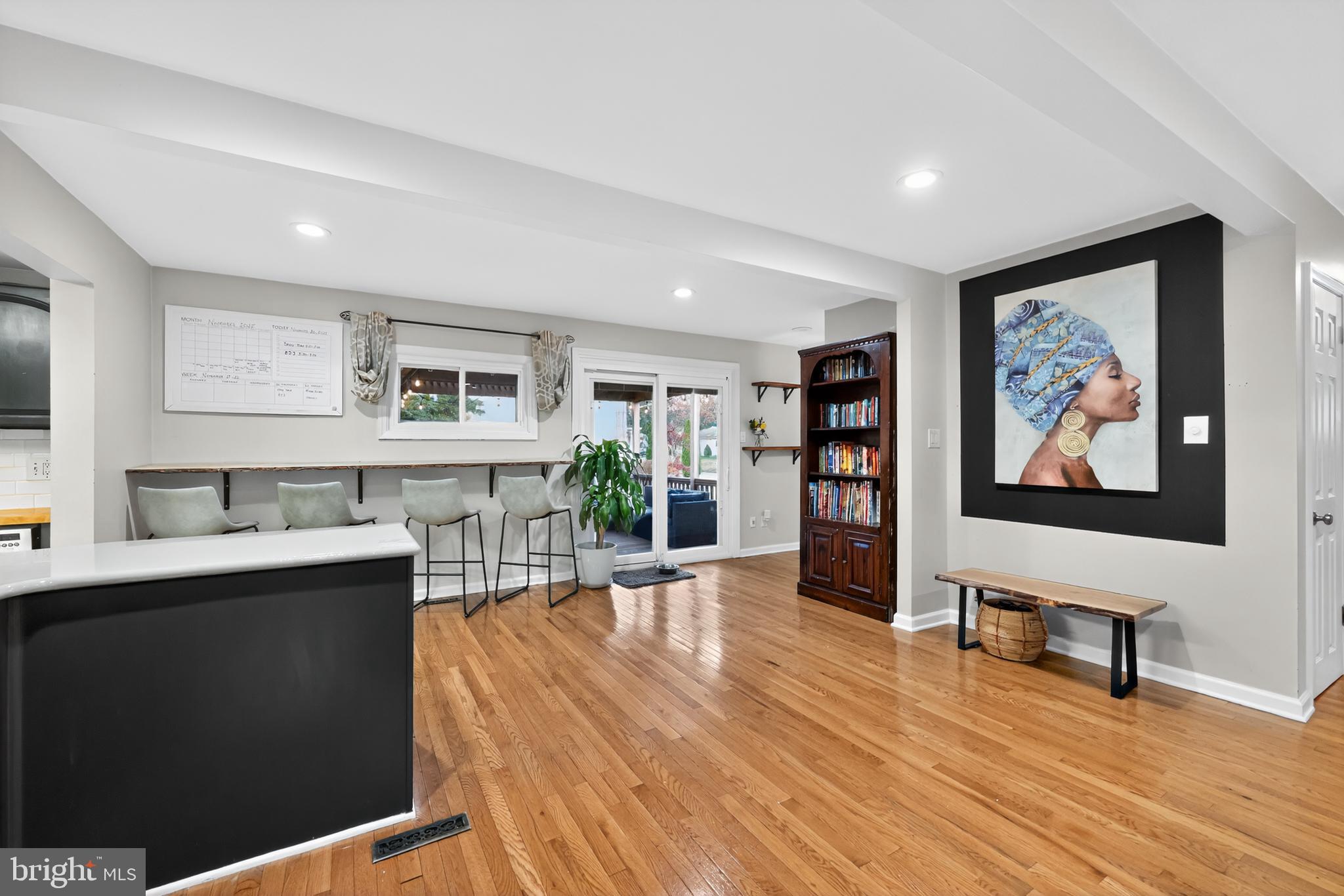 709 Manor Terrace Moorestown, NJ 08057 - Photo 3 of 37 a view of a livingroom with workspace and a flat screen tv