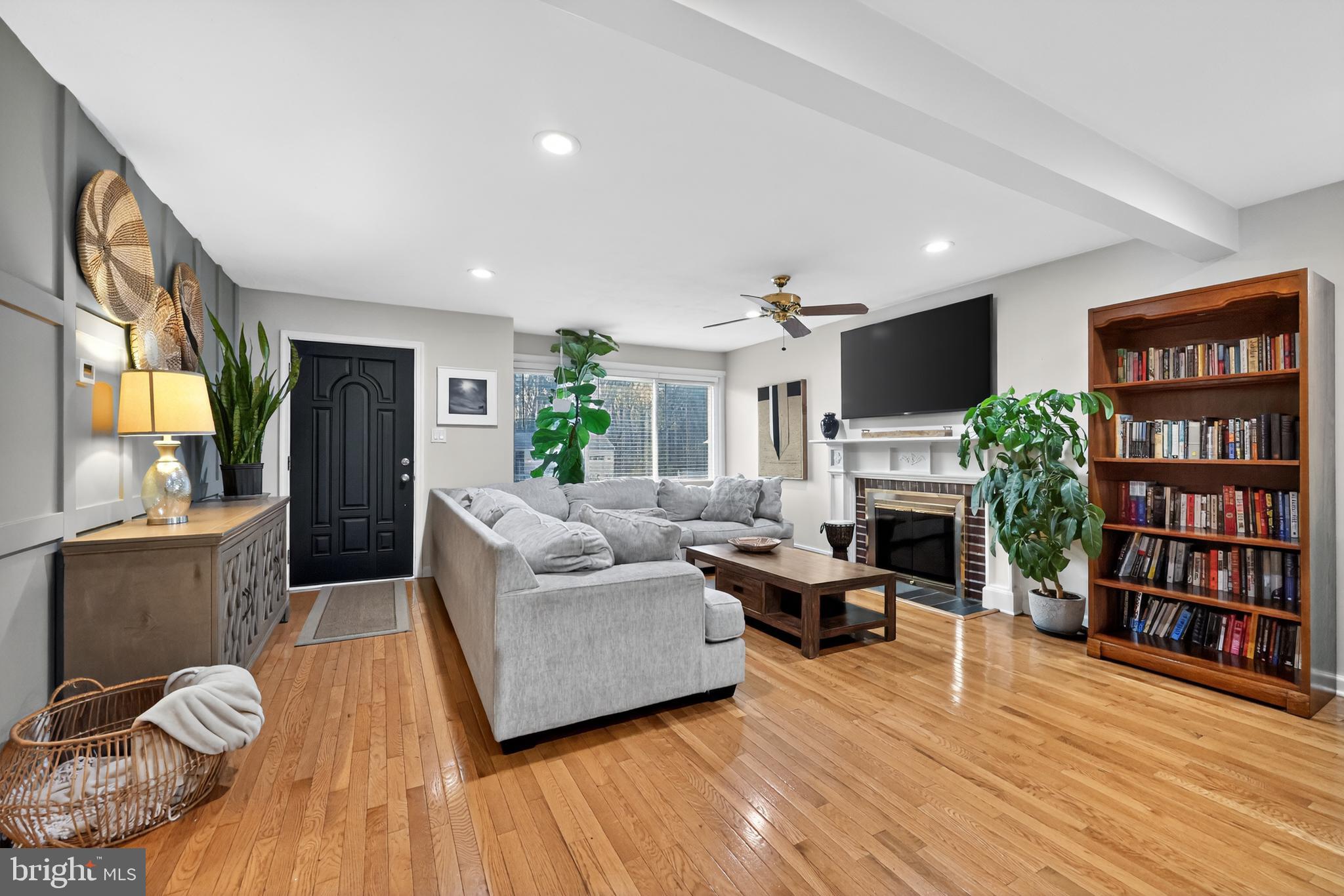709 Manor Terrace Moorestown, NJ 08057 - Photo 4 of 37 a living room with fireplace furniture and a flat screen tv