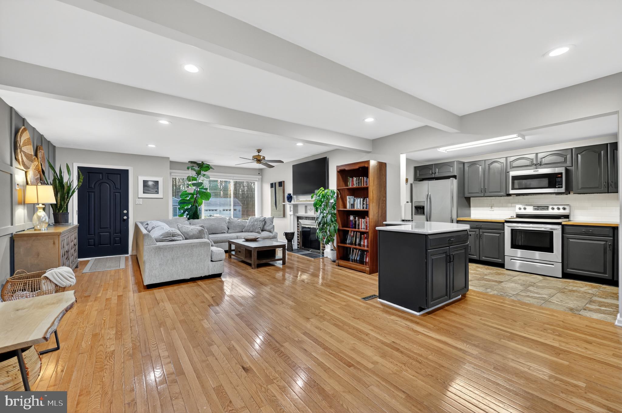 709 Manor Terrace Moorestown, NJ 08057 - Photo 8 of 37 a living room with stainless steel appliances furniture and a kitchen view