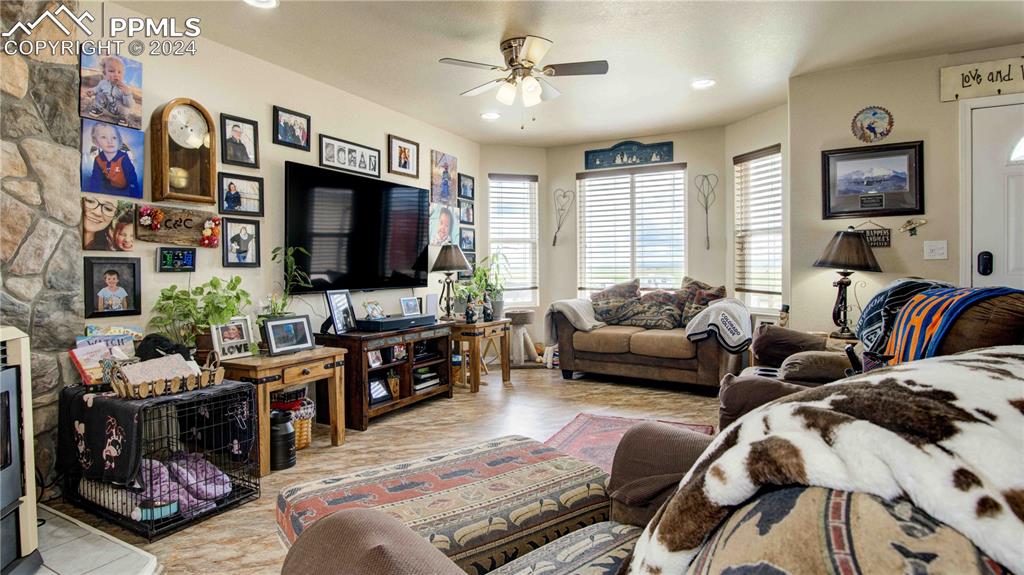 38115 Gieck Road Rush, CO 80833 - Photo 16 of 46 a living room with furniture and a flat screen tv