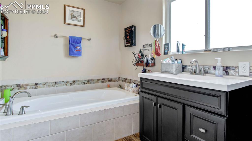 38115 Gieck Road Rush, CO 80833 - Photo 20 of 46 a bathroom with a bathtub and a sink