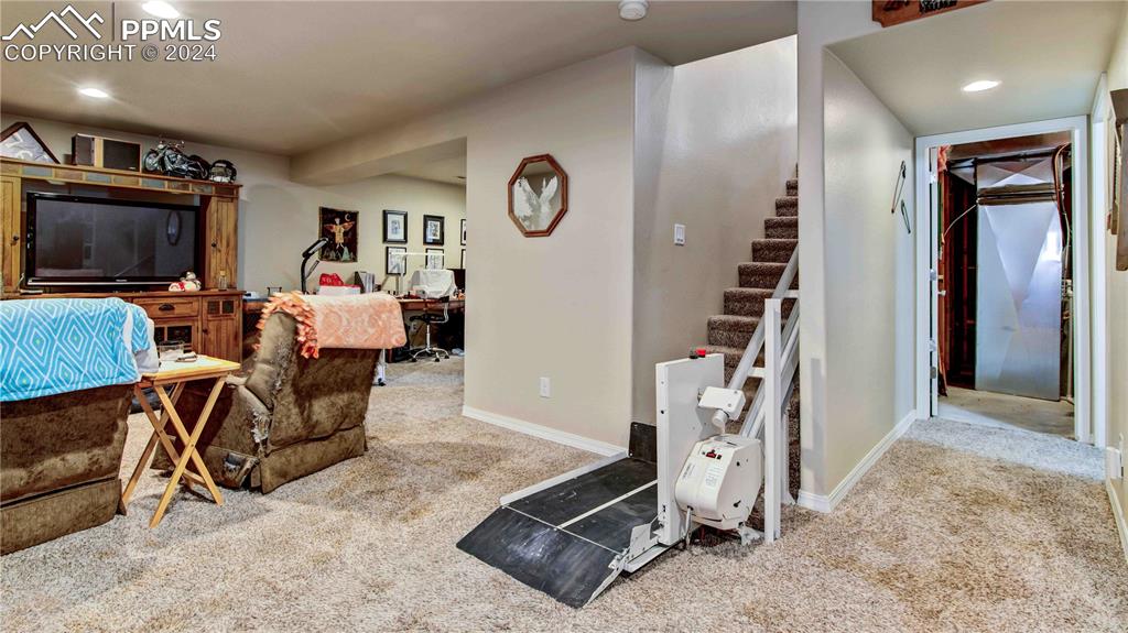 38115 Gieck Road Rush, CO 80833 - Photo 24 of 46 a living room with furniture a flat screen tv and a table