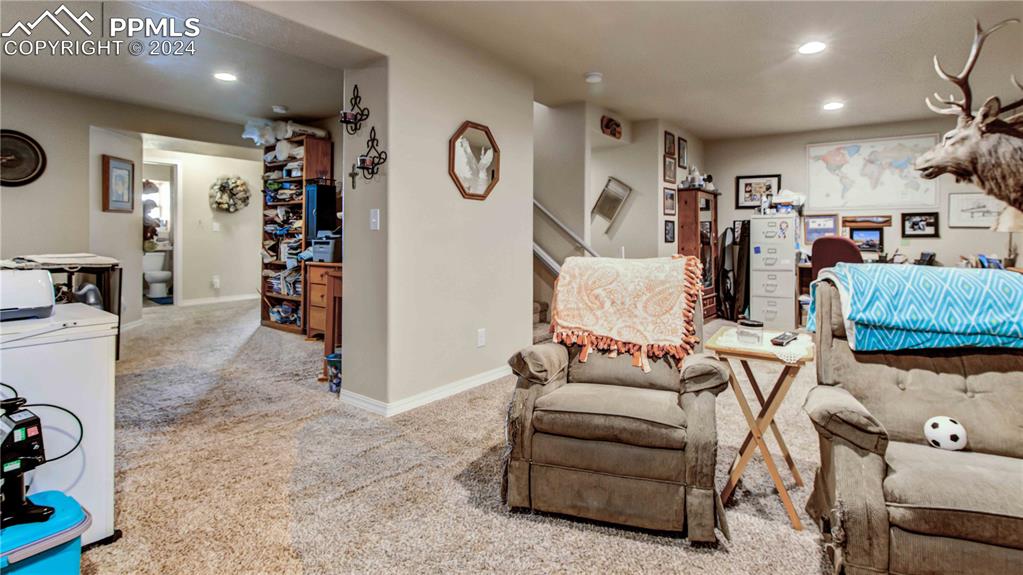 38115 Gieck Road Rush, CO 80833 - Photo 25 of 46 a living room with furniture and a flat screen tv