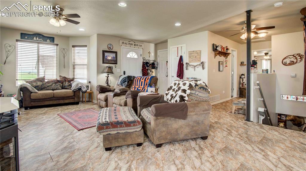 38115 Gieck Road Rush, CO 80833 - Photo 27 of 46 a living room with furniture window and wooden floor