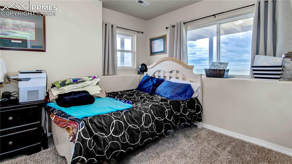 38115 Gieck Road Rush, CO 80833 - Photo 29 of 46 a bedroom with a bed and window