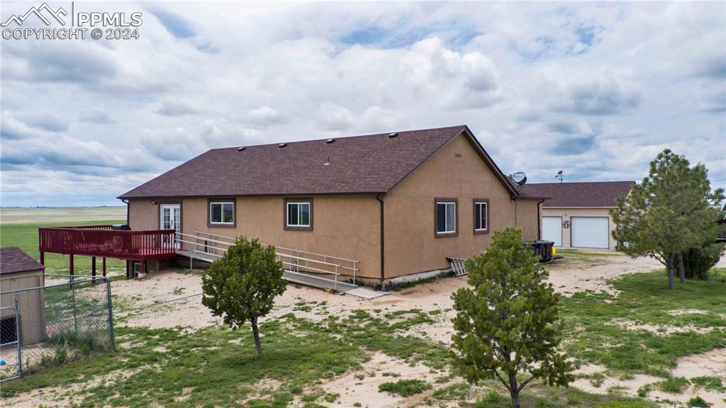 38115 Gieck Road Rush, CO 80833 - Photo 34 of 46 a front view of a house with a yard and garage