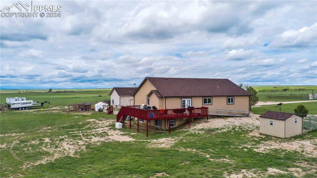 38115 Gieck Road Rush, CO 80833 - Photo 43 of 46 a aerial view of a house with swimming pool and a yard