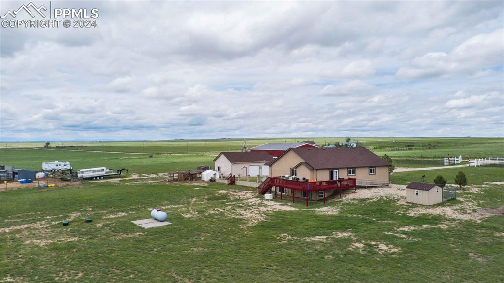 38115 Gieck Road Rush, CO 80833 - Photo 45 of 46 a view of a lake with a house in the background