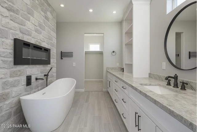 a bedroom with a large bed and a large window