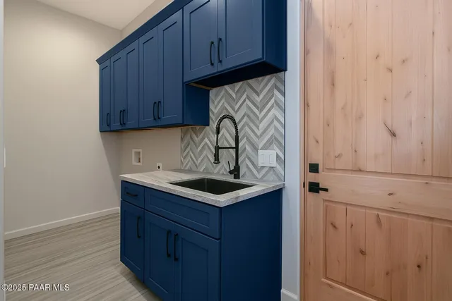 a bathroom with a double vanity sink toilet mirror and bathtub