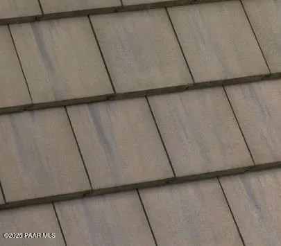 an empty room with stairs and windows