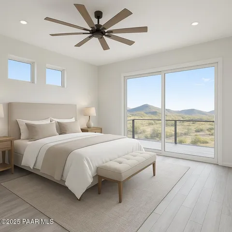 a view of a town with mountains in the background