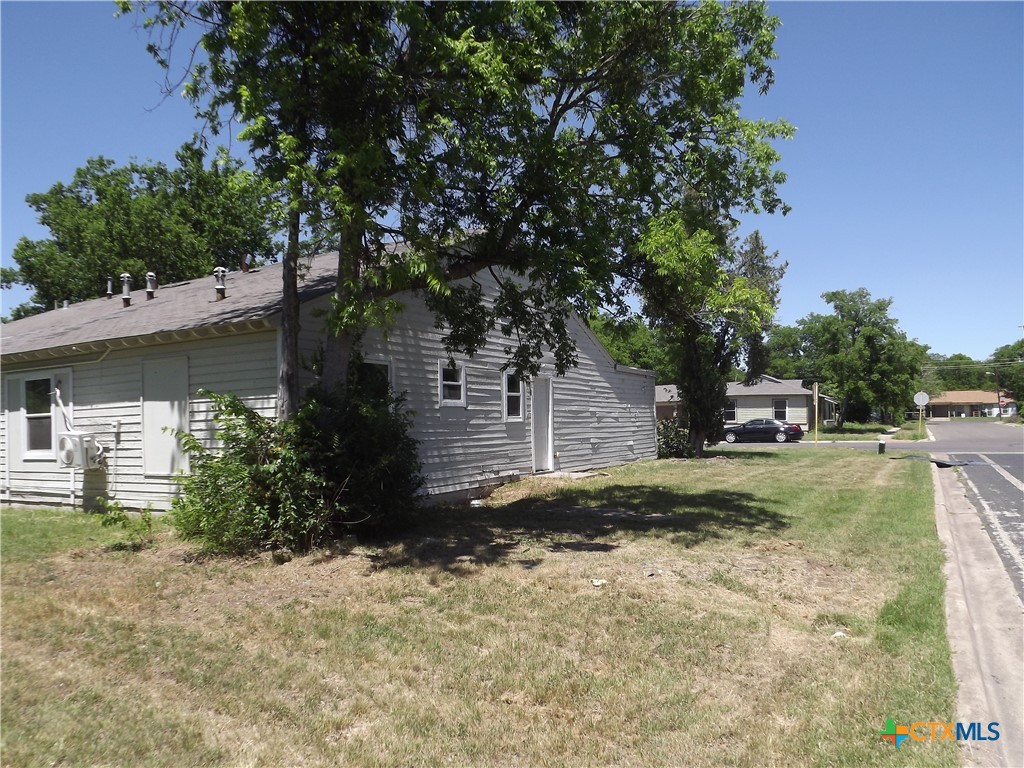 1714 Duncan Avenue Killeen, TX 76541 - Photo 21 of 24 a front view of a house with a yard and garage