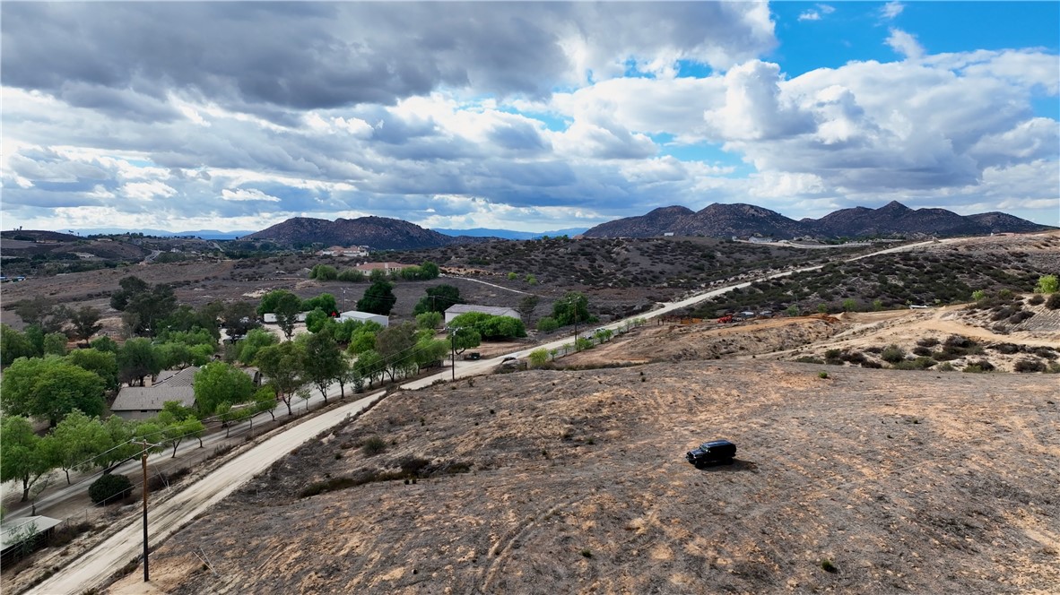 1 Spring Valley Road Temecula, CA 92592 - Photo 3 of 8 a view of a dry yard with mountains in the background