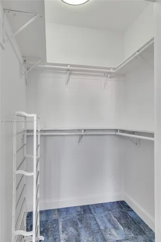 a view of an empty walk in closet