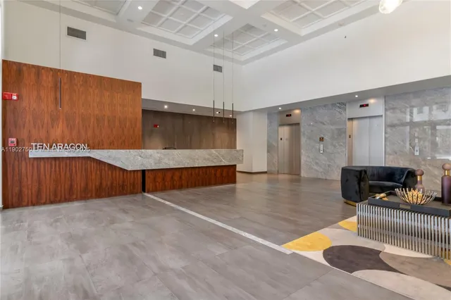 a view of an empty room with furniture